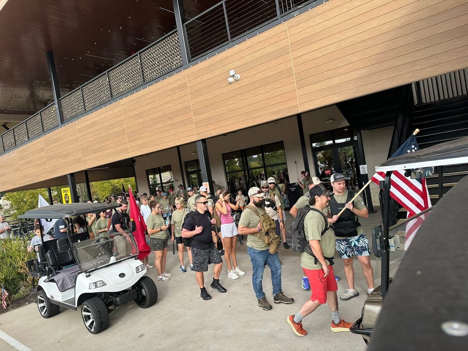 Ruckers stepping off from the start line at Pine Market with flags flying